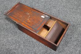 an antique pine box with slide lid