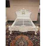 A contemporary white double carved bed frame