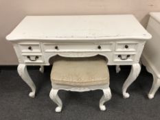 A contemporary white dressing table on cabriole legs with matching stool, width 110 cm.