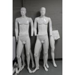 Two male mannequins together with parts