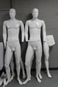 Two male mannequins together with parts