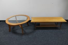 A circular teak glass topped coffee table together with a rectangular teak coffee table with