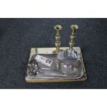 A pair of antique brass candlesticks together with a plated tray of sugar scuttle with scoop,