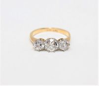 An 18ct gold three-stone diamond ring,