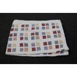 A hand stitched patchwork quilt