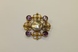 An amethyst and pearl gold brooch