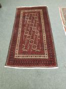 A Persian rug, on red ground,