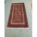 A Persian rug, on red ground,