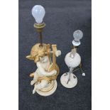 A contemporary cherub figural table lamp and one other
