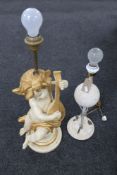 A contemporary cherub figural table lamp and one other