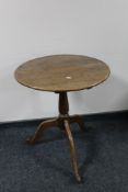 A Victorian mahogany circular occasional table on three way pedestal