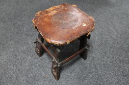 An Arts and Crafts leather seated stool