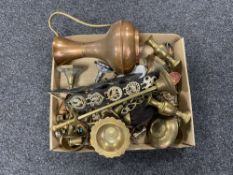 A box of antique and later metal wares to include horse brasses on straps, miniature ornaments,