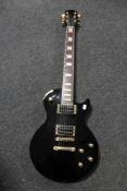 A Les Paul style electric guitar (black)