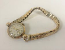 A lady's 9ct gold Everite wristwatch on gold plated expanding strap