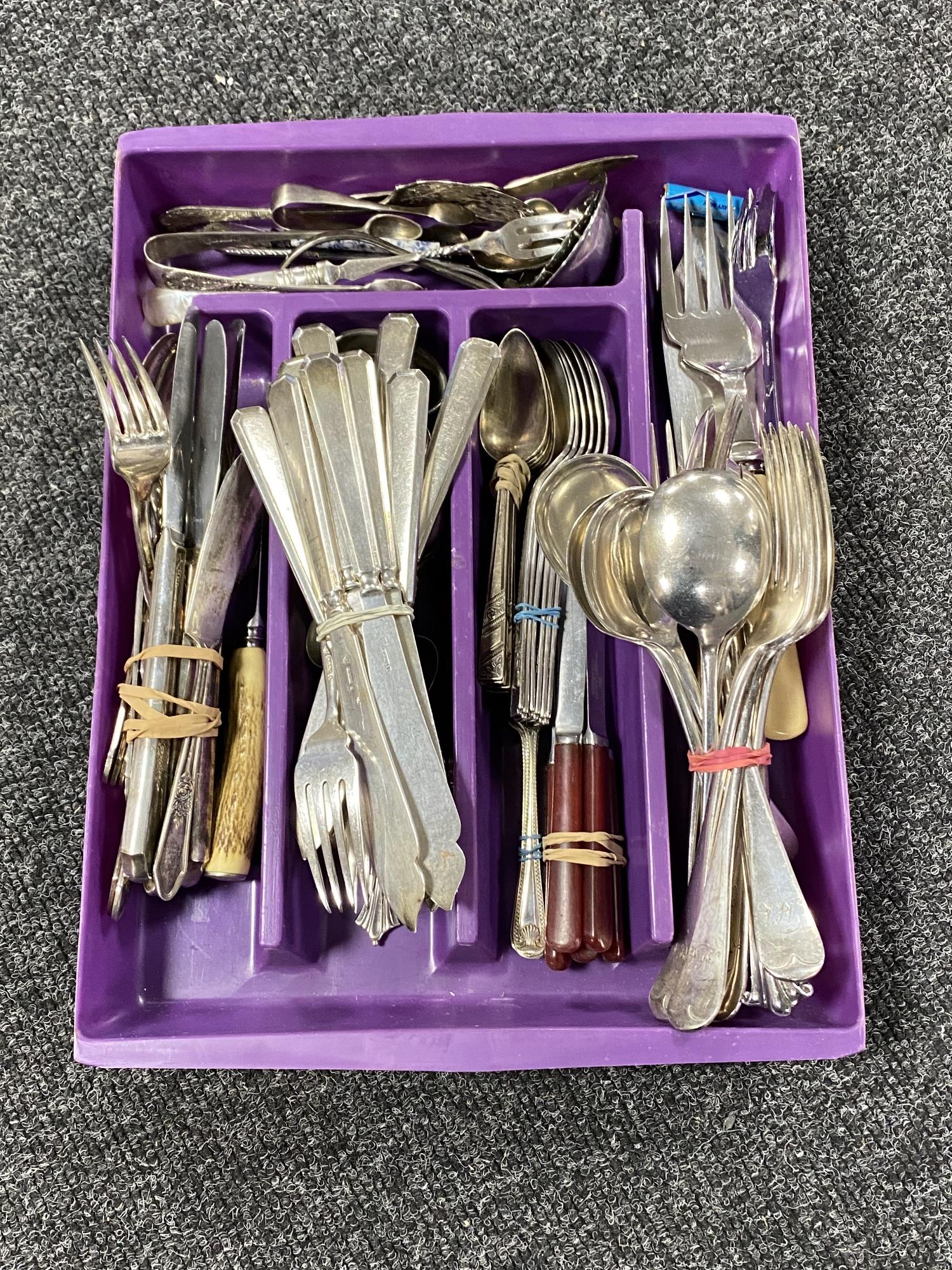 A cutlery tray of assorted plated and stainless steel cutlery
