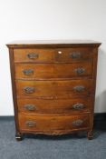 An Edwardian mahogany bow fronted six drawer chest