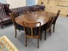 A continental extending dining table and six chairs