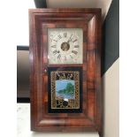 An antique rosewood veneered eight day wall clock