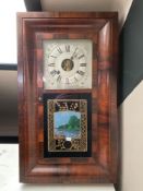 An antique rosewood veneered eight day wall clock