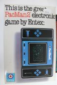 A boxed Entex PacMan 2 electronic hand held game