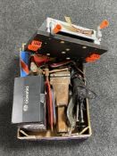 A box containing bottle jacks, heavy duty bench vice, miniature Black & Decker workbench,