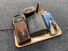 A tray of vintage Kodak camera in case, leather cased field glasses, gent's travel set,