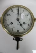 A brass cased Royal Mariner 8 day ship's clock with key