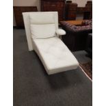 A contemporary cream leather chaise longue,