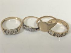 Three 9ct gold rings and another ring, indistinctly stamped (4) CONDITION REPORT: 7.