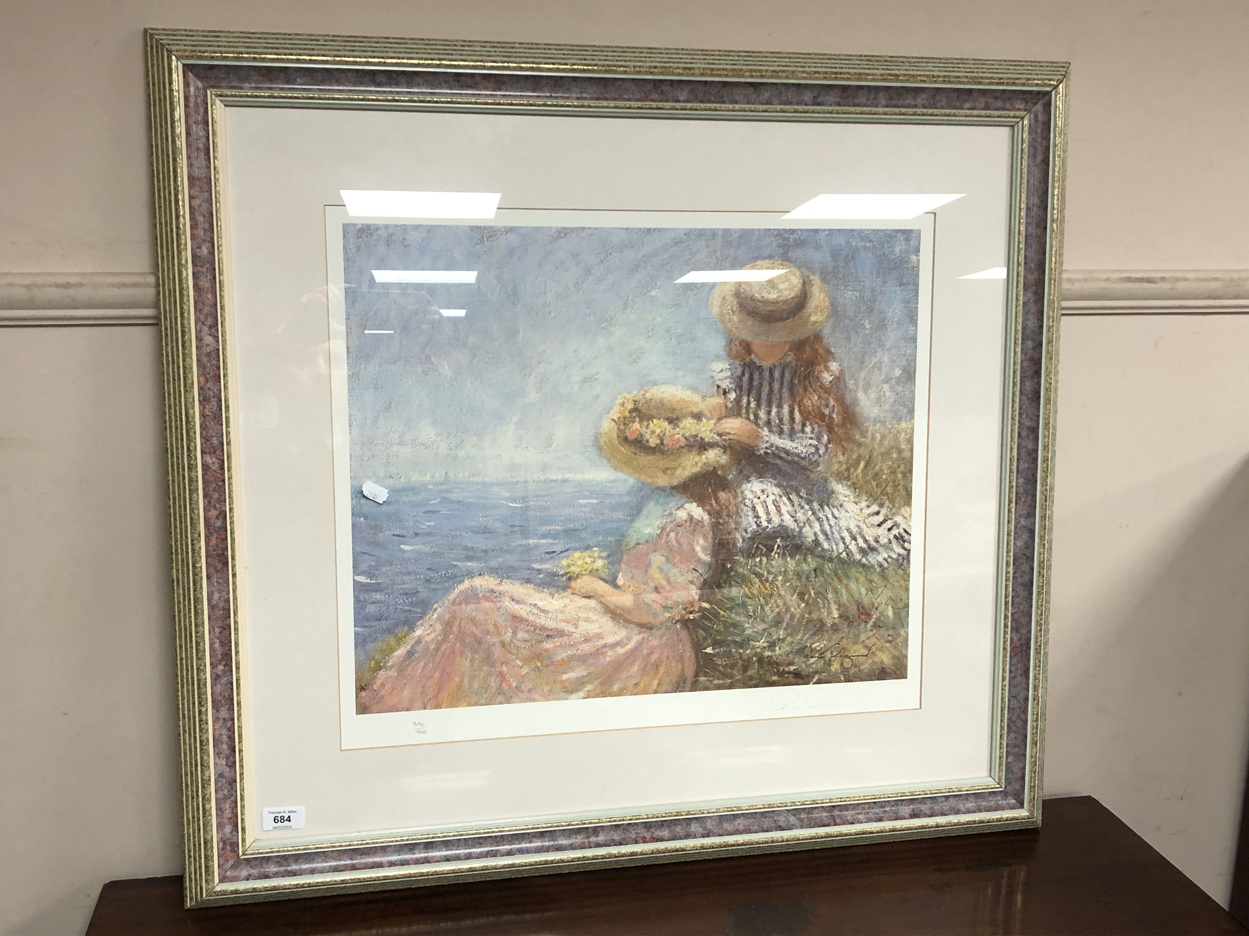 After Legrand : Two figures by the coast, reproduction in colours, signed in pencil, 840/950,
