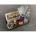 A tray of a brass mantel clock, plated cruet set,