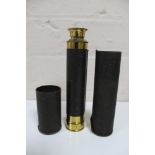 A brass and leather cased pocket telescope
