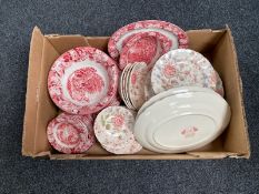 A box of Johnson Brothers Rose Chintz and Woods dinner ware