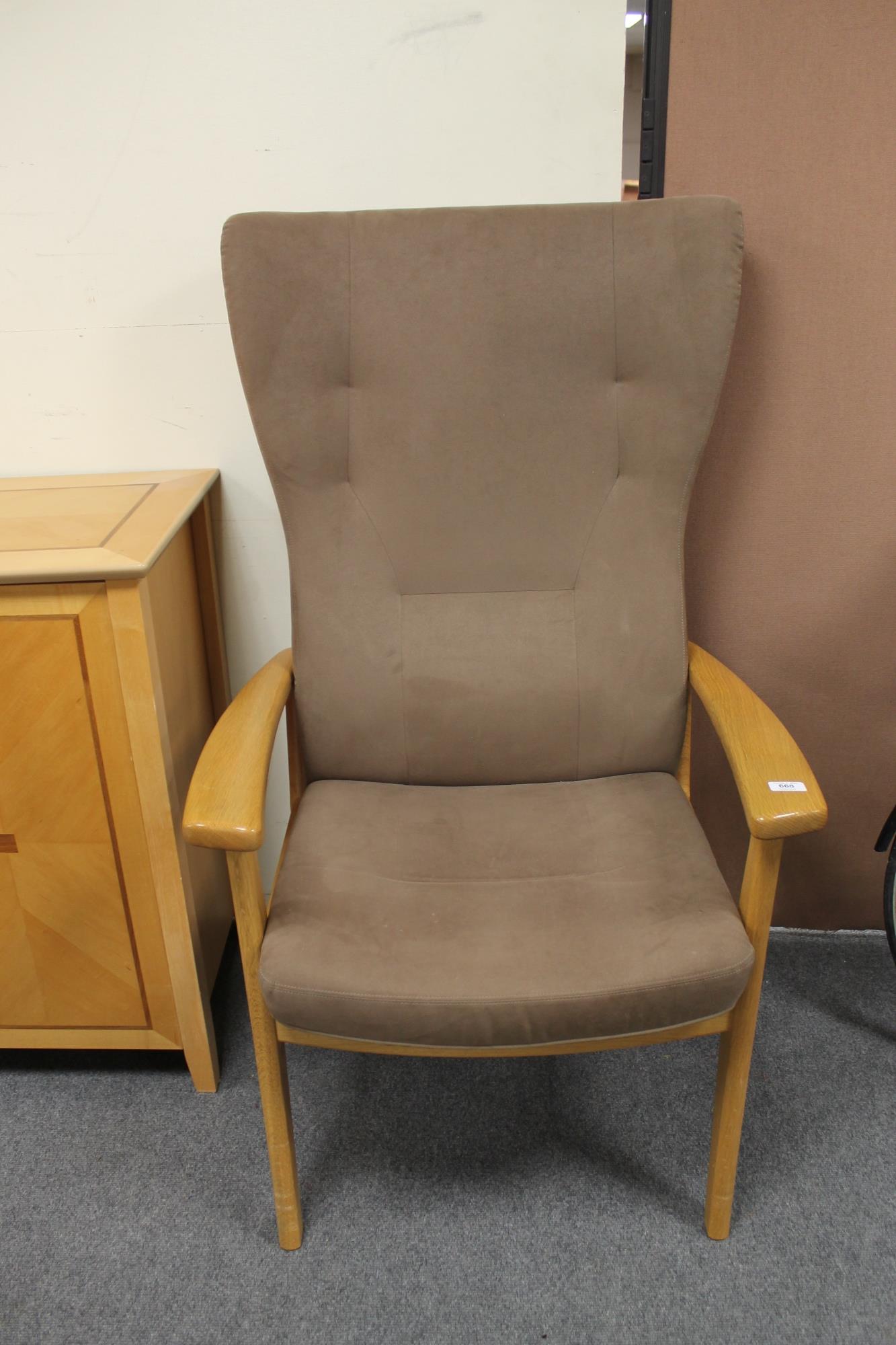 A late 20th century wood framed reclining armchair