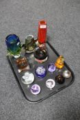 A tray of eight glass paperweights together with five assorted art glass vases and ashtrays