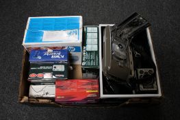 A box of assorted vintage and digital cameras