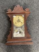 An antique American Buffalo mantel clock by The Gilbert Clock Company
