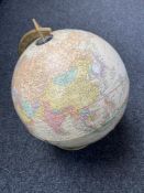 A 12" terrestrial globe on metal stand marked 'Cram Antique'