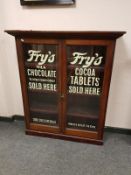 A Victorian and later mahogany display cabinet with Fry's chocolate advertising, width 104 cm.