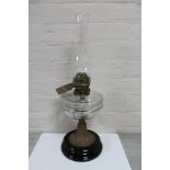 A Victorian Duplex oil lamp with clear glass reservoir and chimney