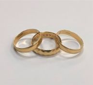 Three 9ct gold band rings, 6.4g.