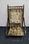 An early 20th century stained beech framed chair
