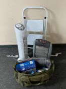 A set of metal folding stool steps together with a tower fan, halogen heater,