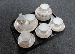 A tray of fifteen piece white and gilt bone china tea service