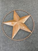 A metal star wall hanging