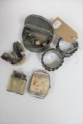 A pair of silver napkin rings together with an antique pewter box, miniature mother of pearl purse,