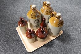 A tray of three Fentimans stoneware flagons with stoppers together with a further four glazed
