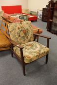 A mid 20th century teak armchair