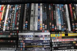 Three boxes containing a large quantity of DVD's